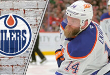 Edmonton Oilers defenseman Mattias Ekholm skating during an NHL game, focused on the play.