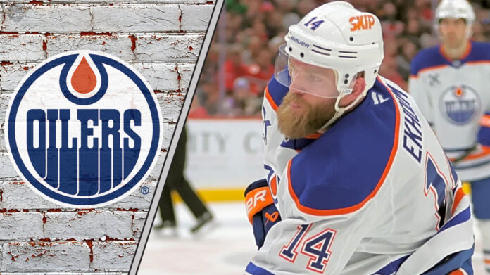 Edmonton Oilers defenseman Mattias Ekholm skating during an NHL game, focused on the play.