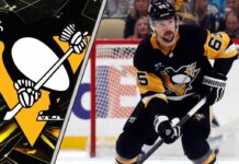 ittsburgh Penguins defenseman Erik Karlsson skates with the puck during an NHL game.