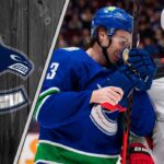 New Jersey Devils star Jack Hughes looks on, amidst speculation he wants to team up with his brother, Vancouver Canucks captain Quinn Hughes.