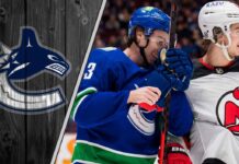 New Jersey Devils star Jack Hughes looks on, amidst speculation he wants to team up with his brother, Vancouver Canucks captain Quinn Hughes.