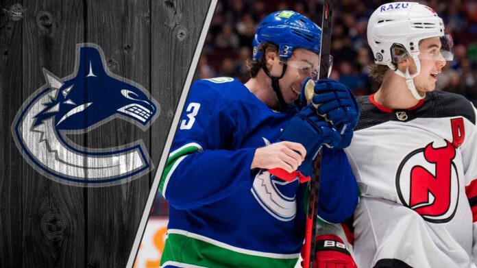 New Jersey Devils star Jack Hughes looks on, amidst speculation he wants to team up with his brother, Vancouver Canucks captain Quinn Hughes.
