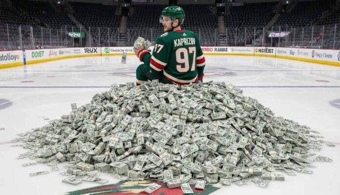 Kirill Kaprizov of the Minnesota Wild sits on a giant pile of money on the ice at his home arena.