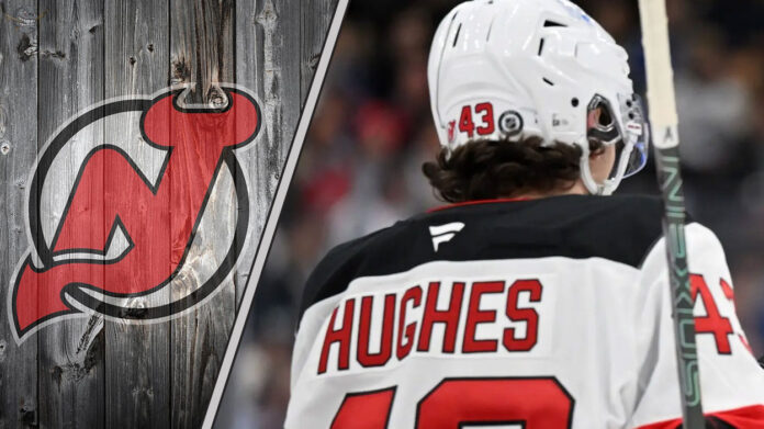 The Battle Over Term: Why This Isn't Just About Money New Jersey Devils defenseman Luke Hughes skating during an NHL game, looking focused on the play.