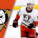 Anaheim Ducks center Mason McTavish skates with the puck during an NHL game, with the Ducks logo visible on his jersey.