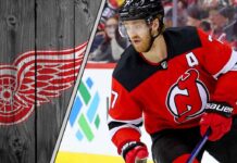 New Jersey Devils defenseman Dougie Hamilton skates during a game, illustrating the NHL trade rumors surrounding his future with the team.