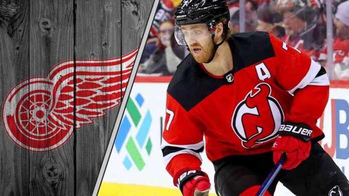 New Jersey Devils defenseman Dougie Hamilton skates during a game, illustrating the NHL trade rumors surrounding his future with the team.