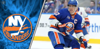New York Islanders captain Anders Lee skating in his blue and orange jersey during an NHL game, looking focused.