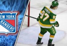 Image of Kirill Kaprizov skaking with the New York Rangers logo in the background.