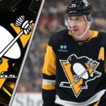 Evgeni Malkin on the Move? The Rumors are Swirling, and 3 Teams are Waiting Pittsburgh Penguins center Evgeni Malkin looks on with concern during an NHL game as NHL trade rumors swirl.