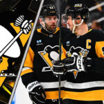 Is a Stealth Rebuild Underway for the Pittsburgh Penguins? Pittsburgh Penguins players celebrating a goal amidst swirling NHL trade rumors