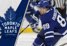 oronto Maple Leafs forward Nick Robertson skating with the puck as NHL trade rumors circle around him