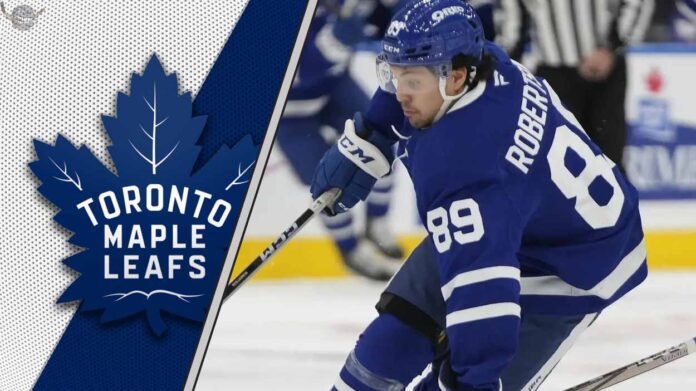 oronto Maple Leafs forward Nick Robertson skating with the puck as NHL trade rumors circle around him