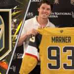An image of Mitch Marner holding a Vegas Golden Knights jersey