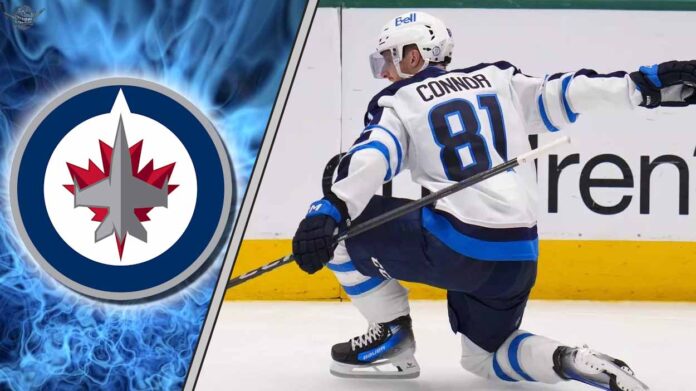 winnipeg-jets-kyle-connor-contract-negotiations Winnipeg Jets star forward Kyle Connor celebrates a goal during an NHL game, looking to make a play as the team works to sign him to a new contract.