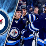 Winnipeg Jets players celebrating a win on the ice