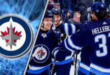 Winnipeg Jets players celebrating a win on the ice