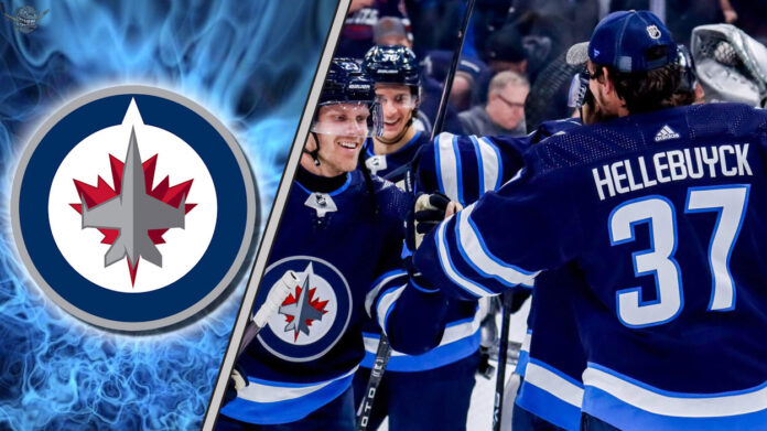 Analyzing the Jets' Big Questions Winnipeg Jets players celebrating a win on the ice