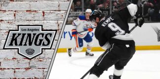 Adrian Kempe skating in his Los Angeles Kings jersey during an NHL game.