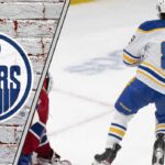 Alex Tuch Trade Rumors: Analyzing the Fit for the Edmonton Oilers and Boston Bruins Alex Tuch skates in his Buffalo Sabres jersey during an NHL game, eyed by the Edmonton Oilers and Boston Bruins.