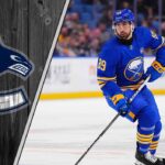 Alex Tuch to the Canucks? The Surprising Trade Rumor That Makes Perfect Sense Buffalo Sabres forward Alex Tuch skates with the puck, with the Vancouver Canucks logo in the background, representing the latest NHL trade rumors.