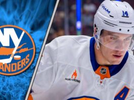 New York Islanders center Bo Horvat skates hard during an NHL game, looking focused in his blue and orange jersey.