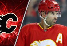 Calgary Flames center Nazem Kadri skates with the puck during an NHL game.