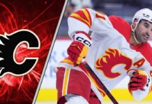 Calgary Flames center Nazem Kadri skates during an NHL game, as trade rumors swirl about his future with the team.