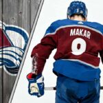 Colorado Avalanche defenseman Cale Makar skates with the puck during an NHL game, poised to make a play.