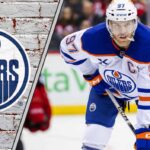 Connor McDavid standing on the ice thinking about his future with the Edmonton Oilers