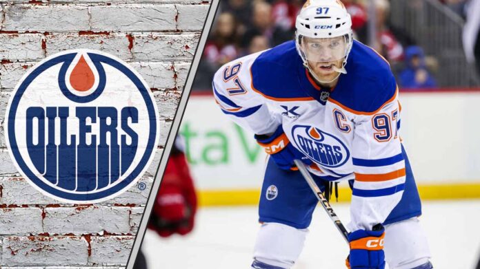 Connor McDavid standing on the ice thinking about his future with the Edmonton Oilers