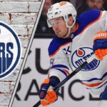 Edmonton Oilers Face Tough Roster Decision: Is Ty Emberson the Odd Man Out? Edmonton Oilers defenseman Ty Emberson skates with the puck during an NHL game, representing a potential trade asset for the team amid roster decisions.