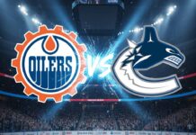 A stylized promotional graphic showing the Edmonton Oilers logo and the Vancouver Canucks logo colliding, with 'VS' in the center, inside a packed Rogers Arena with spotlights.