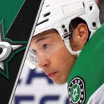 Jason Robertson’s Future: Will the Dallas Stars Pay Up or Trade Their Star Winger? Dallas Stars forward Jason Robertson, in uniform, looking focused on the ice during an NHL game, amid ongoing speculation about his contract and trade status.
