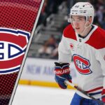 Montreal Canadiens defenseman Lane Hutson skating with the puck during an NHL game.