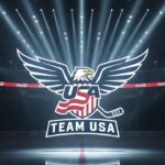 The Goalie, The Scorer, and The Future: Analyzing USA’s New Olympic Additions Team USA logo with a background image of a hockey arena representing the future of the Team USA projected roster.