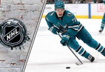 NHL future star Macklin Celebrini in his San Jose Sharks jersey skating with the puck