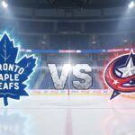 A stylized graphic of the Toronto Maple Leafs and Columbus Blue Jackets logos facing each other at center ice, with "VS" between them, inside a packed hockey arena.