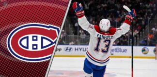 Montreal Canadiens forward Cole Caufield smiles and raises his stick, celebrating a goal on the ice.