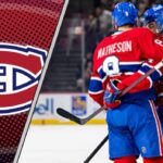 Montreal Canadiens defenseman Mike Matheson skating with the puck during an NHL game, looking focused and determined.