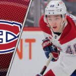 Montreal Canadiens defenseman Lane Hutson skating with the puck during an NHL game.