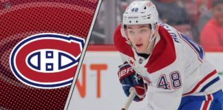 Montreal Canadiens defenseman Lane Hutson skating with the puck during an NHL game.