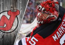 ew Jersey Devils goalie Jacob Markstrom in action, making a save during an NHL game.