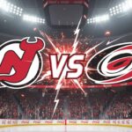 An image showing the New Jersey Devils logo on the left and the Carolina Hurricanes logo on the right, with a "VS" in explosive text between them, set against the backdrop of a packed ice hockey arena with bright spotlights and "Coca-Cola" logos on the rink boards