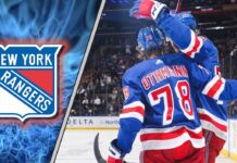 New York Rangers forward Brennan Othmann celebrates during an NHL game, amidst NHL trade rumors