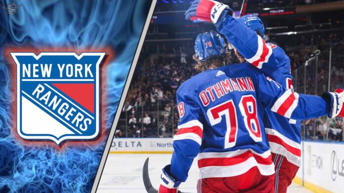 New York Rangers forward Brennan Othmann celebrates during an NHL game, amidst NHL trade rumors