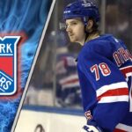 New York Rangers prospect Brennan Othmann skates during his recall, facing an uncertain future amid NHL trade rumors.