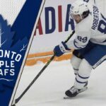 Toronto Maple Leafs forward Nick Robertson skates during an NHL game amid ongoing trade speculation about his future.