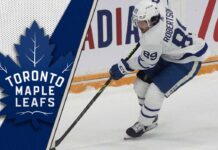 Toronto Maple Leafs forward Nick Robertson skates during an NHL game amid ongoing trade speculation about his future.