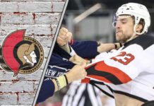 Ottawa Senators defenseman Kurtis MacDermid in a fight during an NHL game.